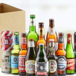 Different beer bottles and a cardboard box